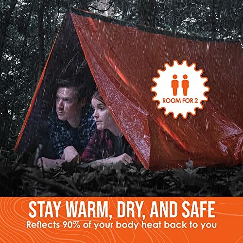 Two people under an orange emergency shelter in the rain.