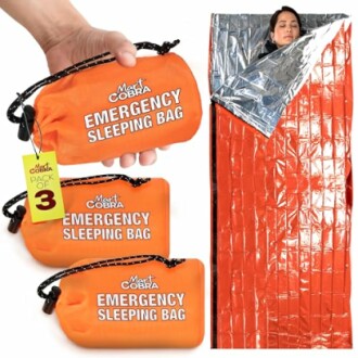 Emergency sleeping bag with woman inside and compact orange bags.