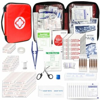 Contents of a first aid kit including bandages, scissors, and antiseptic wipes.